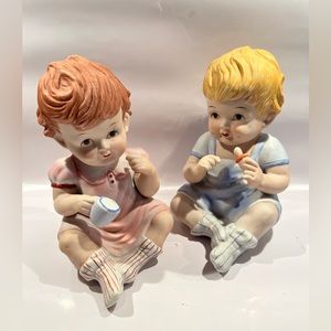 Set Of Two Vintage Porcelain Bisque Sitting Piano Babies Figurines 7.25"